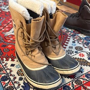 Sorel Tan and Black Winter Boots